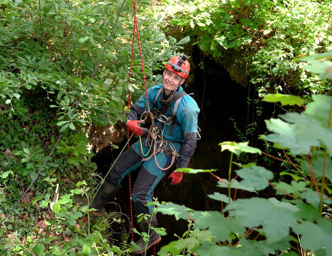 Mine Explorer on rope at Okel Tor Mine. Photo by Cornwall Underground Adventures