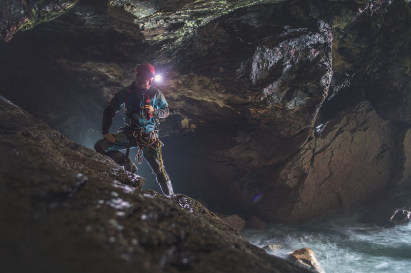 Cornwall Underground Adventures guide exploring in a Cornish cliff mine.