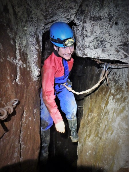 Mine explorer traverses a flooded passage in a Cornish tin mine.