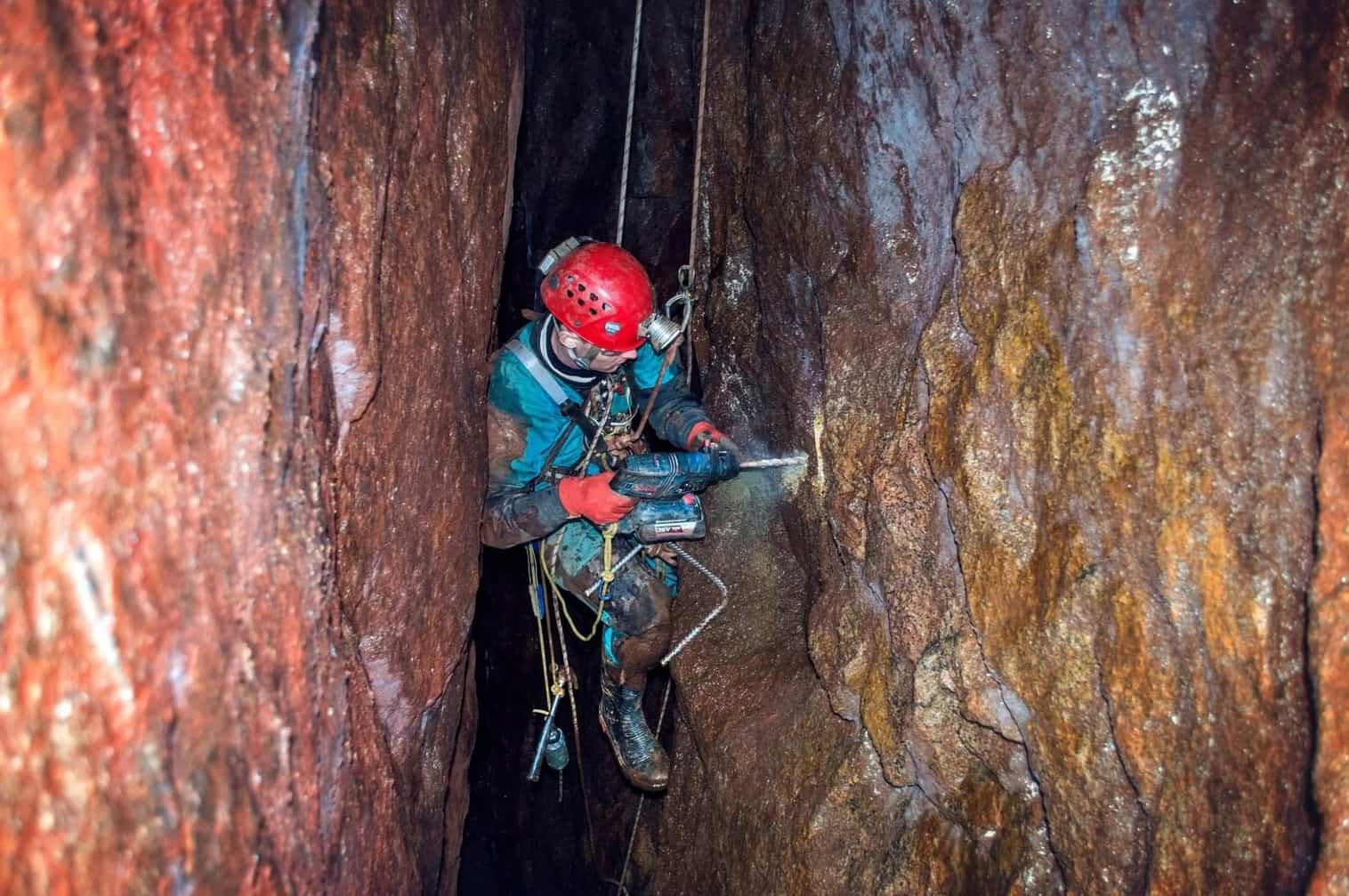 Mine instructor using SRT to install ladder rungs in a Cornish tin mine