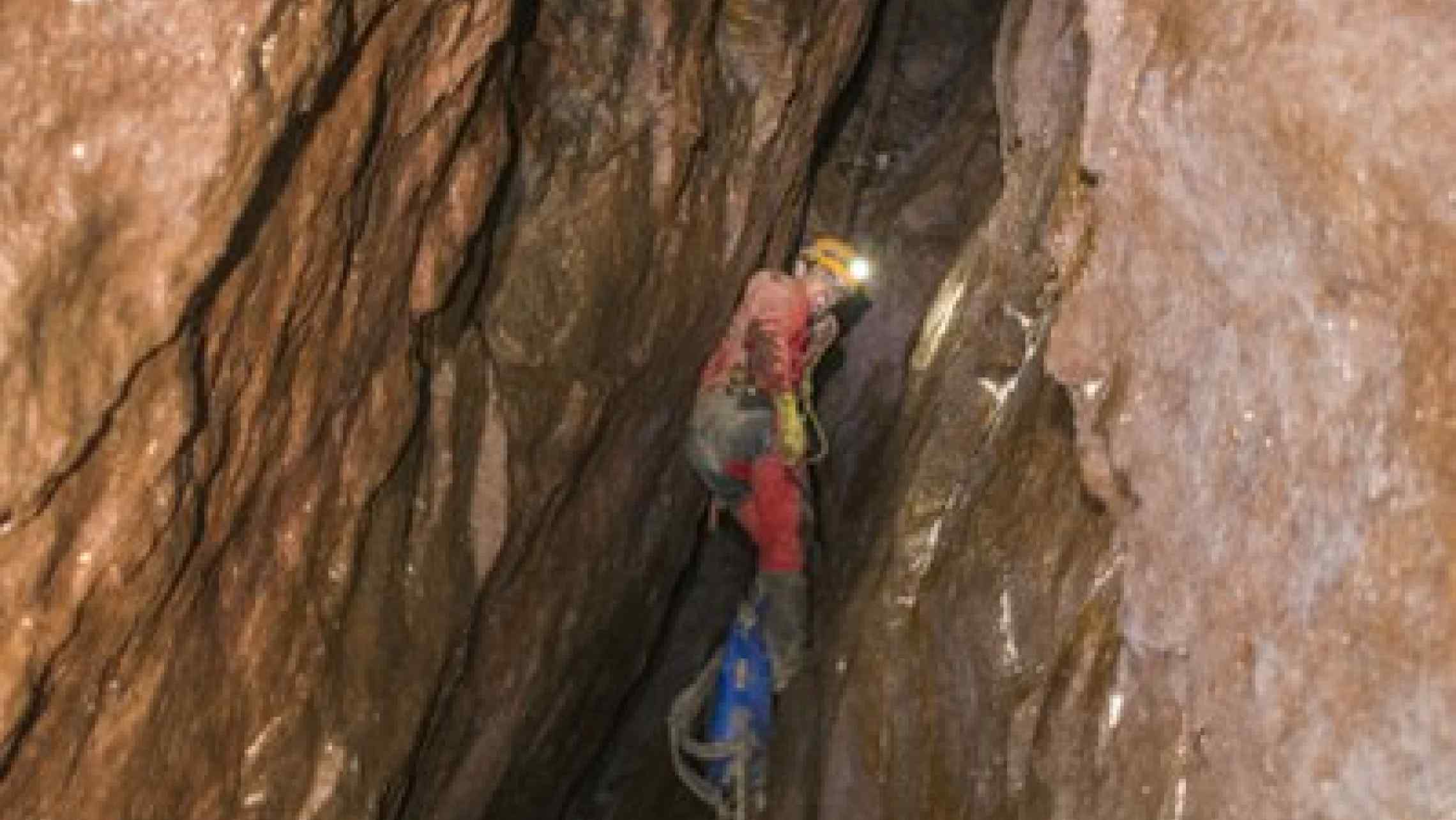 Mine explorer abseiling down a stope in a Cornish tin mine near St. Just, Cornwall. Cornwall's best adventure!