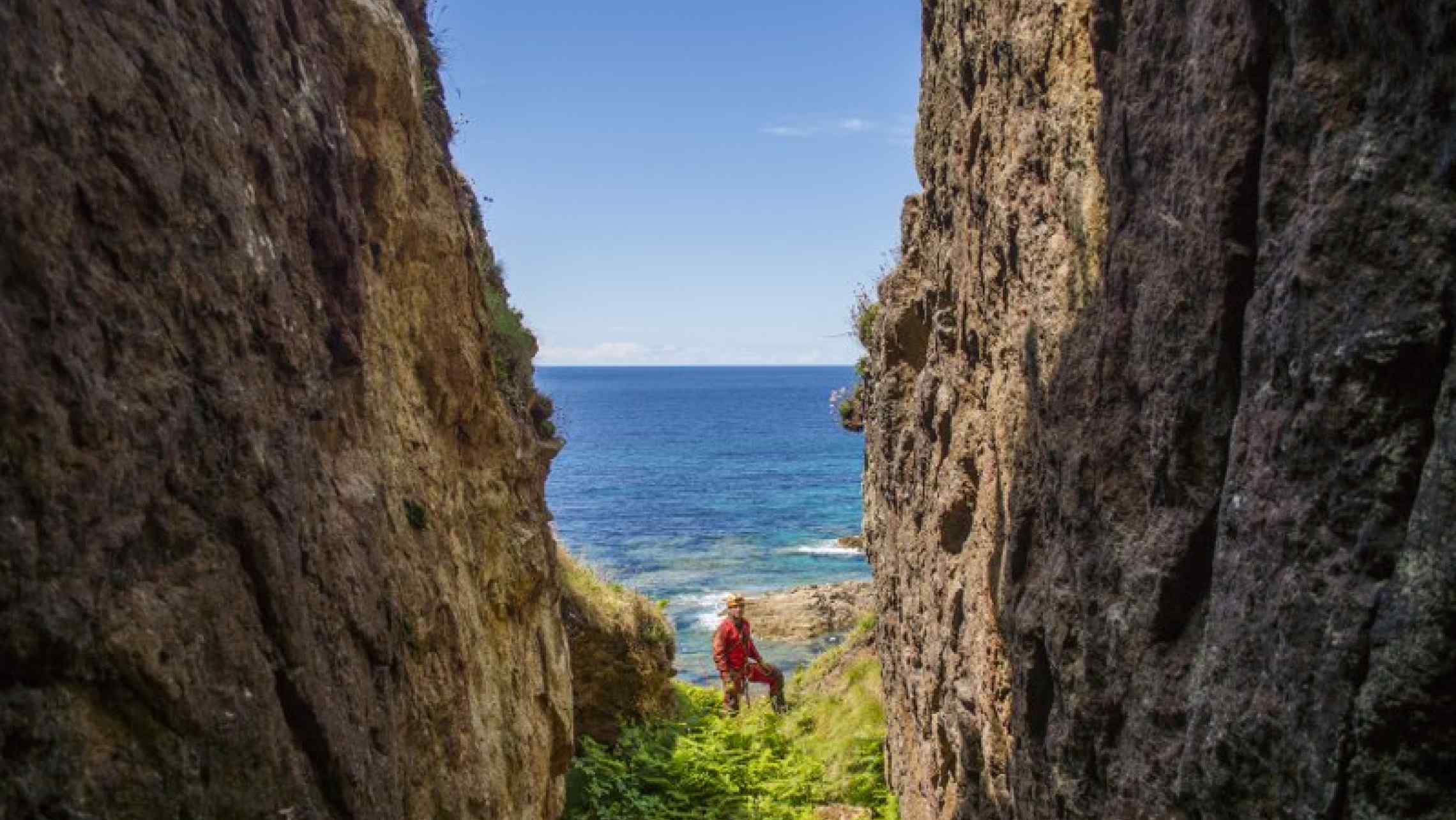 Cornwall Underground Adventure guide exploring an open stope in a Cornish cliff