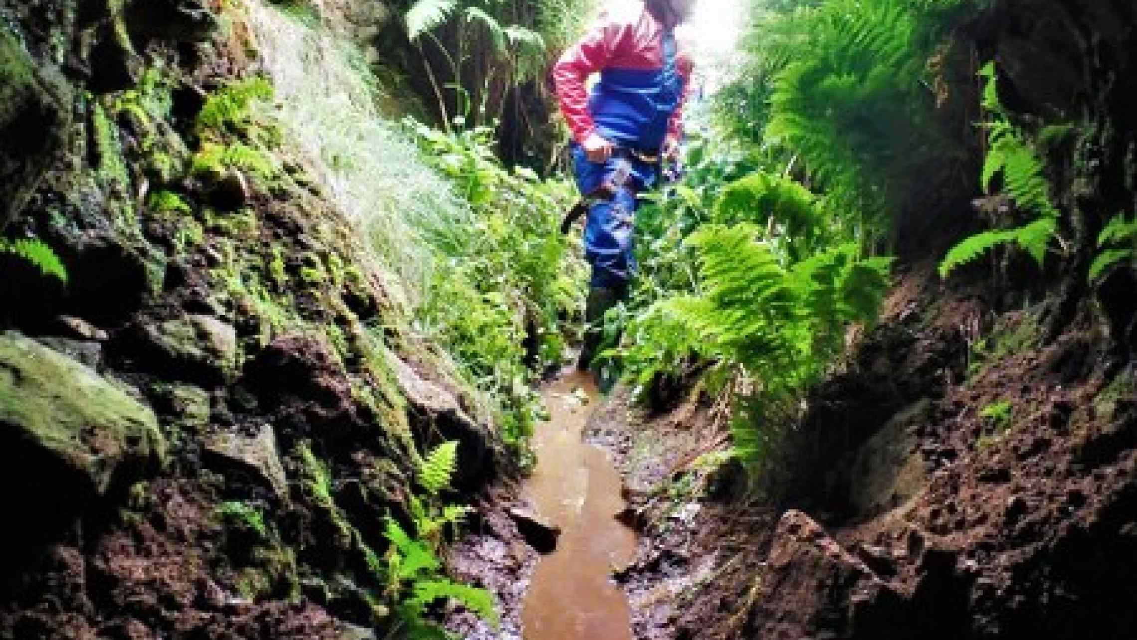 School group on a mine tour in Cornwall. Mine tours for school groups in west Cornwall. Visit and learn about ancient tin mines.