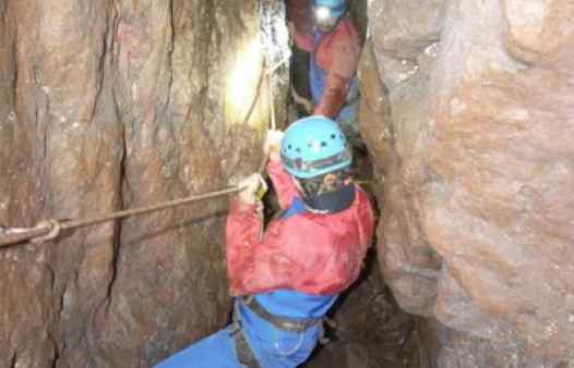 Traversing across a tin mine shaft deep underground in Cornwall.
