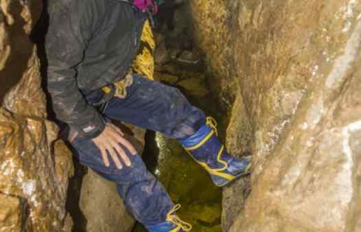 Chimney climbing a narrow, flooded passage. Classic adventure days out in a Cornish tin mine. Authentic mine tours.