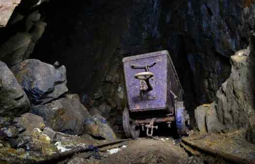 An abandoned mine cart in a Cornish tin mine. Step into the boots of the Cornish miners on an underground adventure. The ultimate day out in Cornwall, Newquay, St. Ives or Penzance.