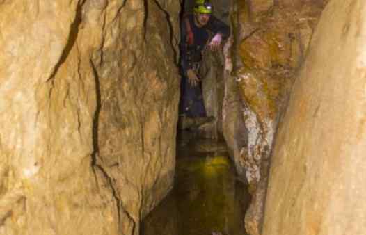Cornwall's Underground adventures have many obstacles, like crossing this flooded passage in a tin mine in Cornwall.