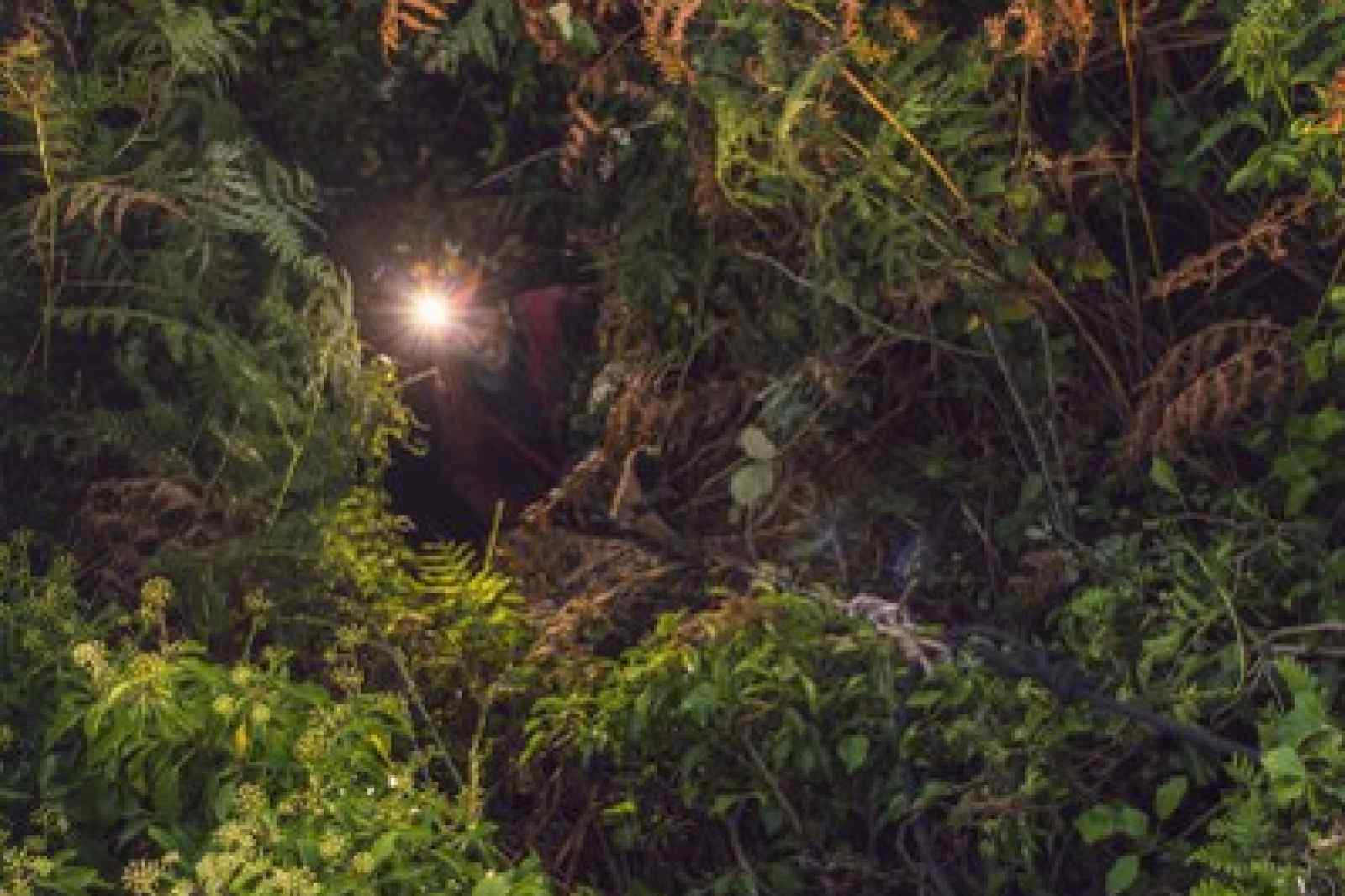 Cornish mine explorer looking up form a Cornish tin mine shaft