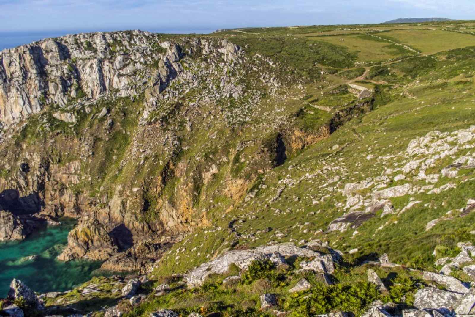 Tin mine ruins in a beautiful Cornish Valley. Cornwall's entire landscape was shaped by tin mining. But the real wonders lie deep underground. Explore underground with Cornwall Underground Adventures.